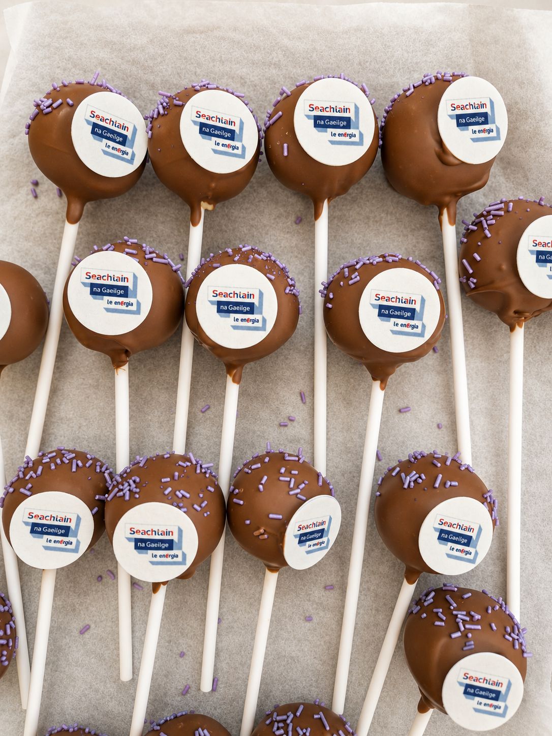 Branded corporate cake pops with edible company logos and Belgian chocolate coating
