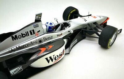 Miniature F1 Minichamps 1/18 – McLaren MP4/12 Mercedes 1997, Coulthard, West
