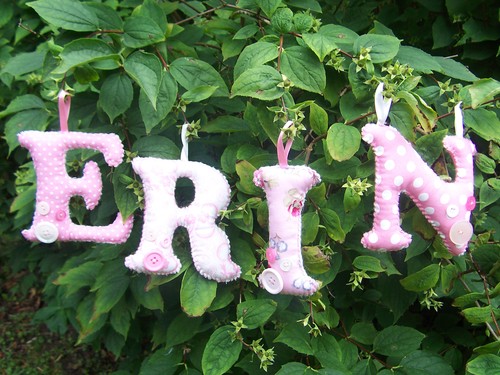 Fabric and felt letter decoration with button detail