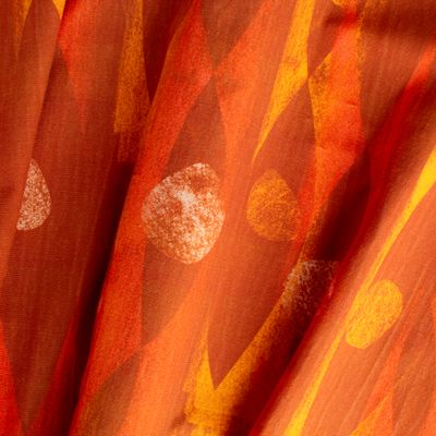 Iris Flame geometric fabric with angular forms and circles in orange on cotton-linen