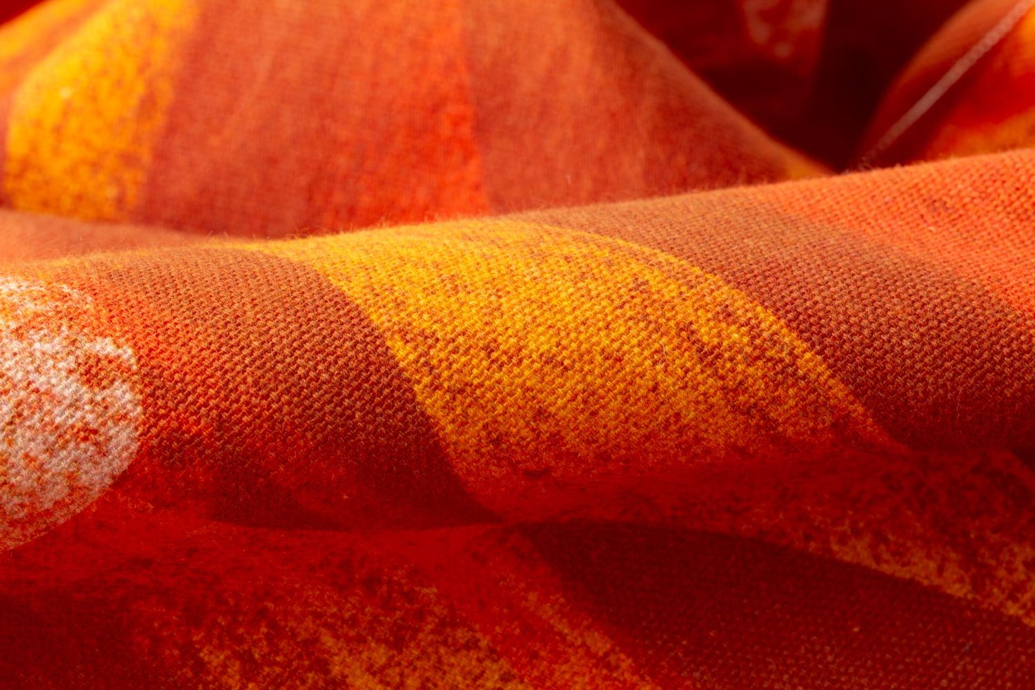 Close-up detail of Iris Flame fabric showing crisp cut-out edges and texture