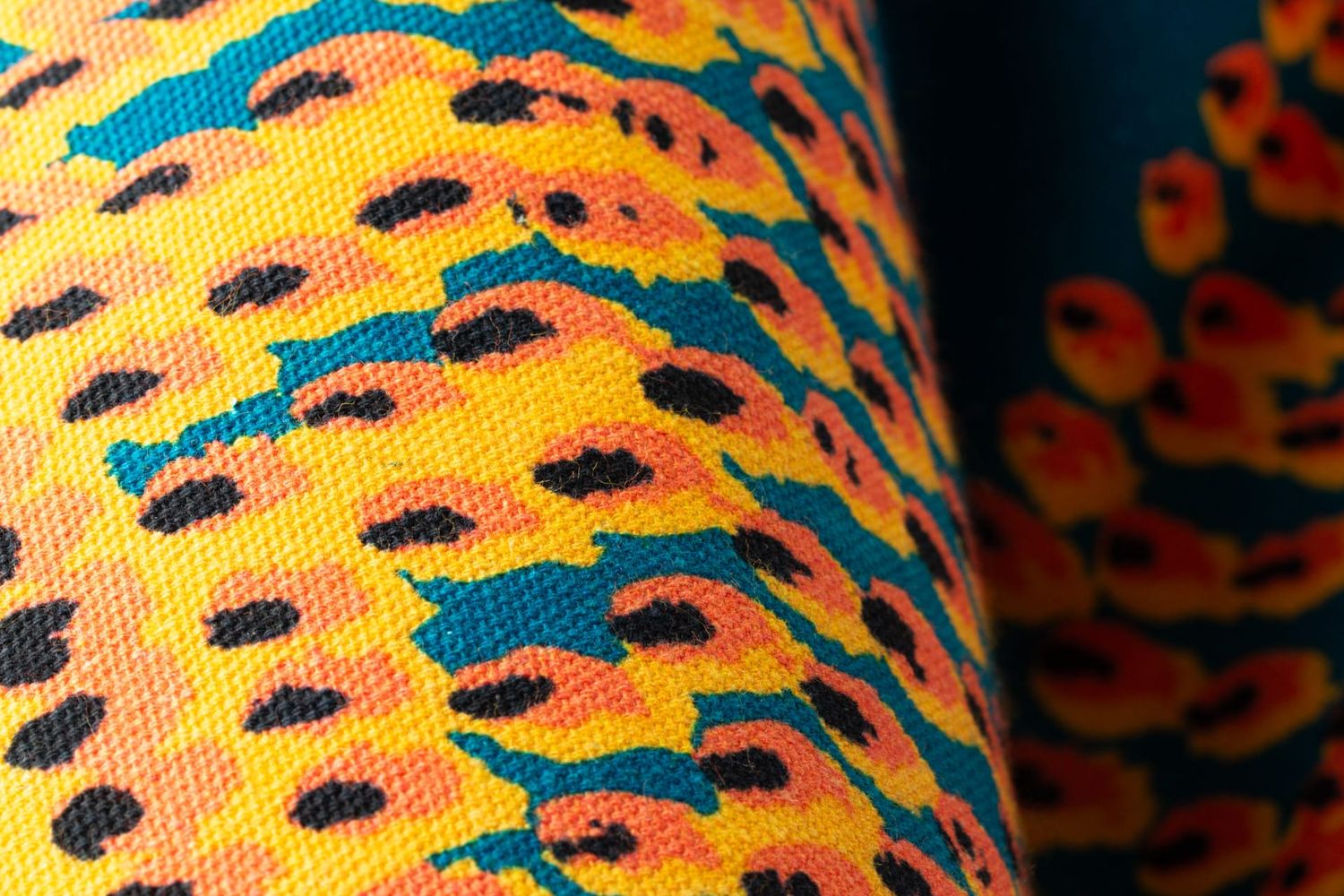 Close-up detail of Pilot Flame fabric showing energetic flame texture