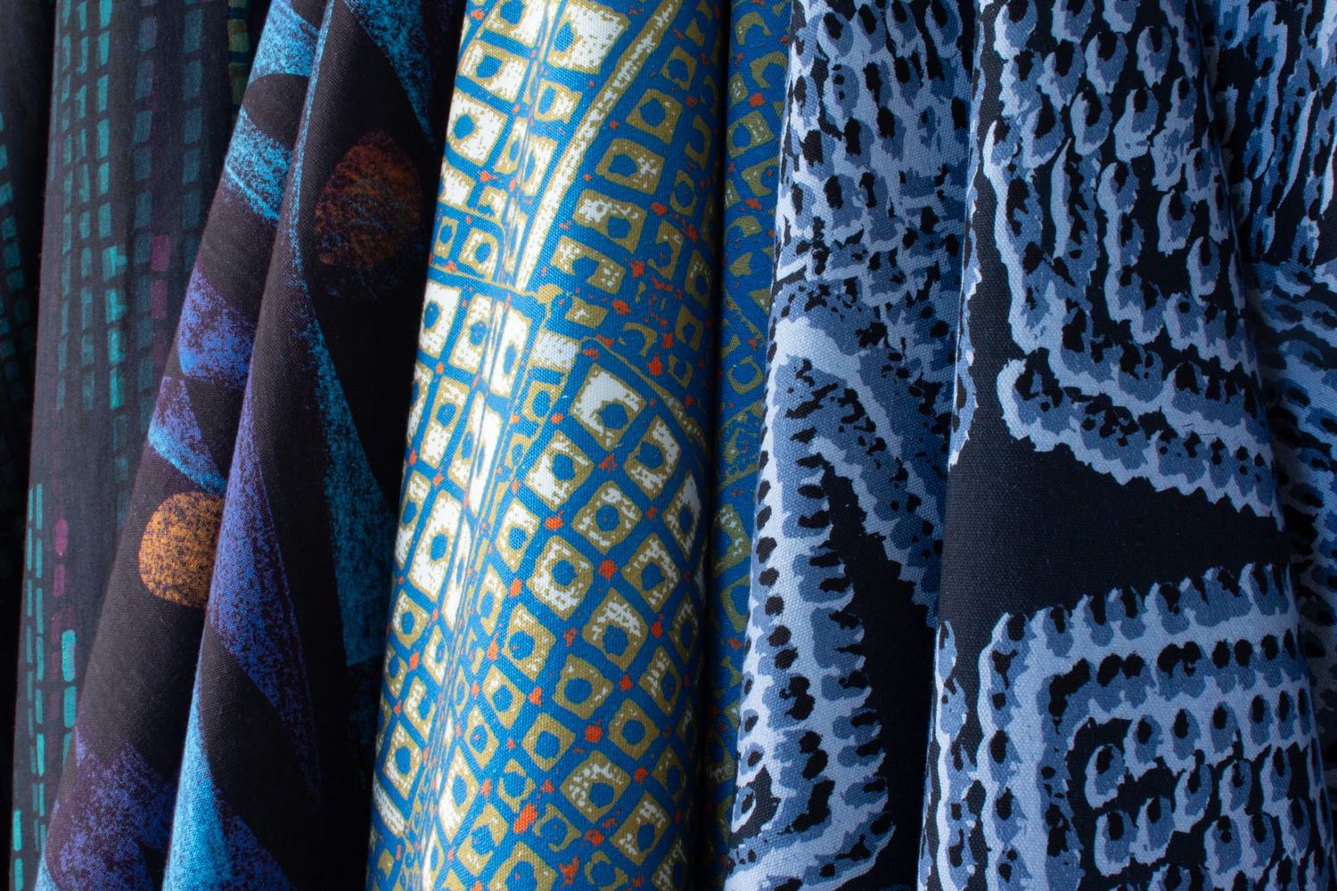 Ampli collection River colorway group showing Swan, Quiver, Pilot and Iris patterns in blue tones