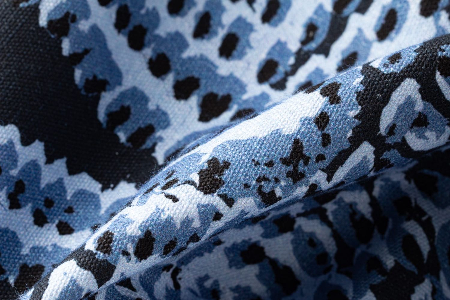 Close-up detail of Pilot River fabric showing flickering flame texture