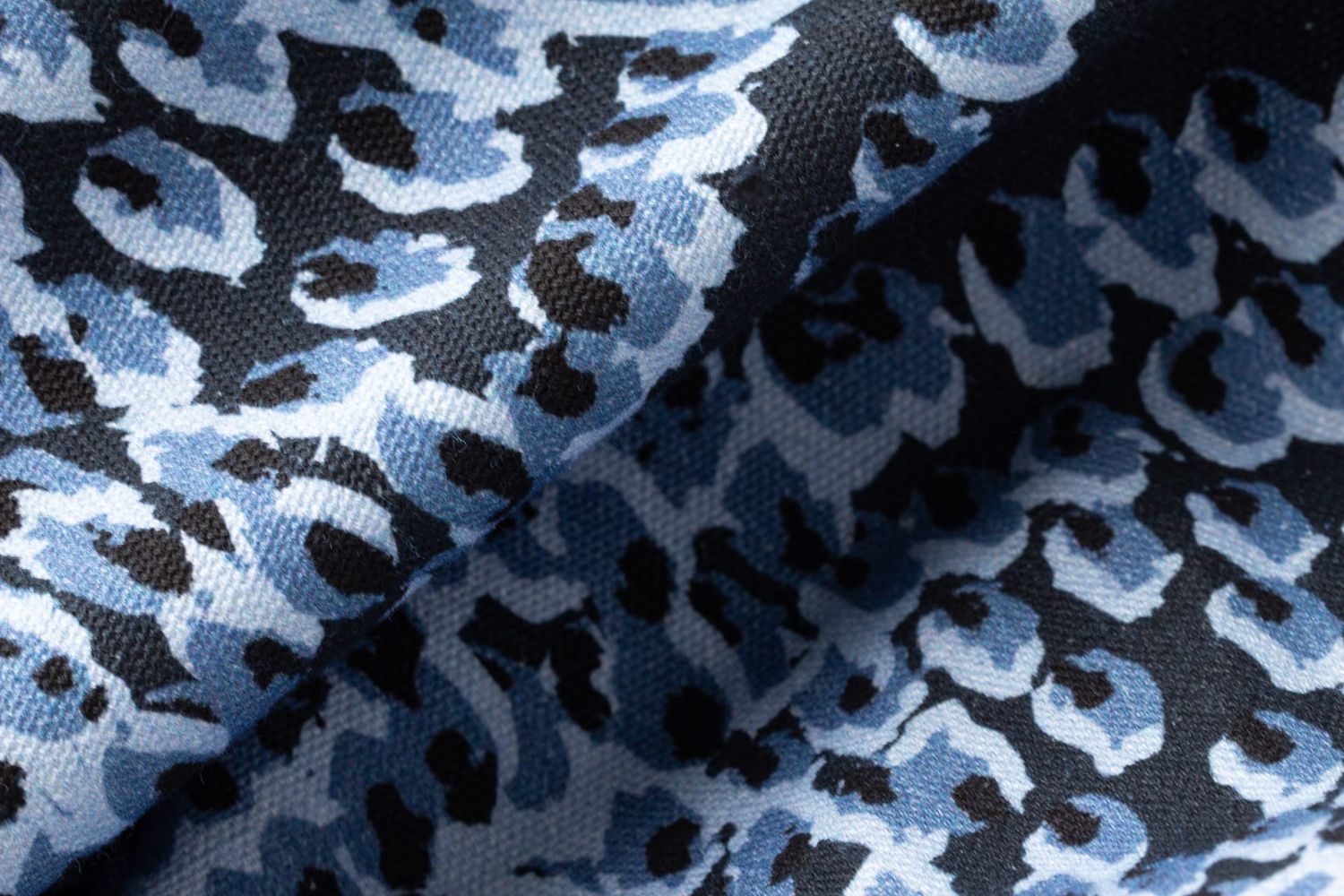 Close-up detail of Pilot River fabric showing flickering flame texture
