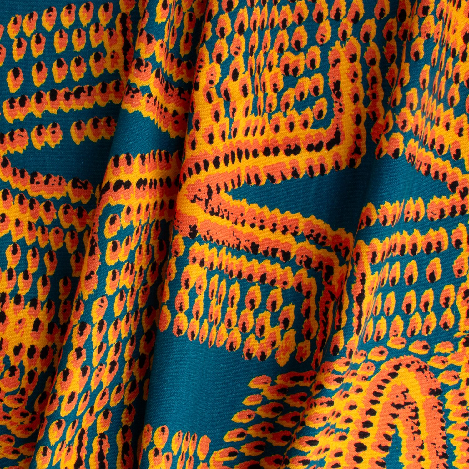 Pilot Flame fabric displaying scaled-up flame-like marks in orange on cotton-linen