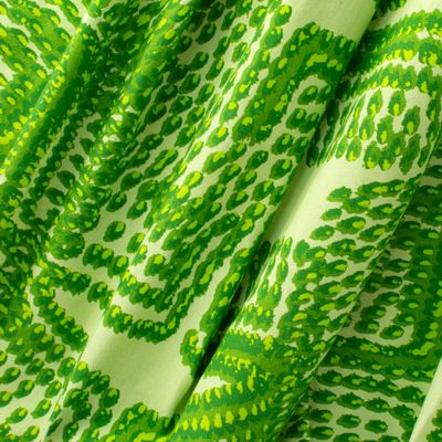 Pilot Leaf fabric displaying scaled-up flame-like marks in green on cotton-linen