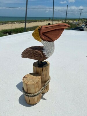 Handcrafted Wooden Pelican on Dock Pilings