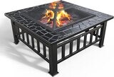 A fire bowl with a grill grate and a spark guard