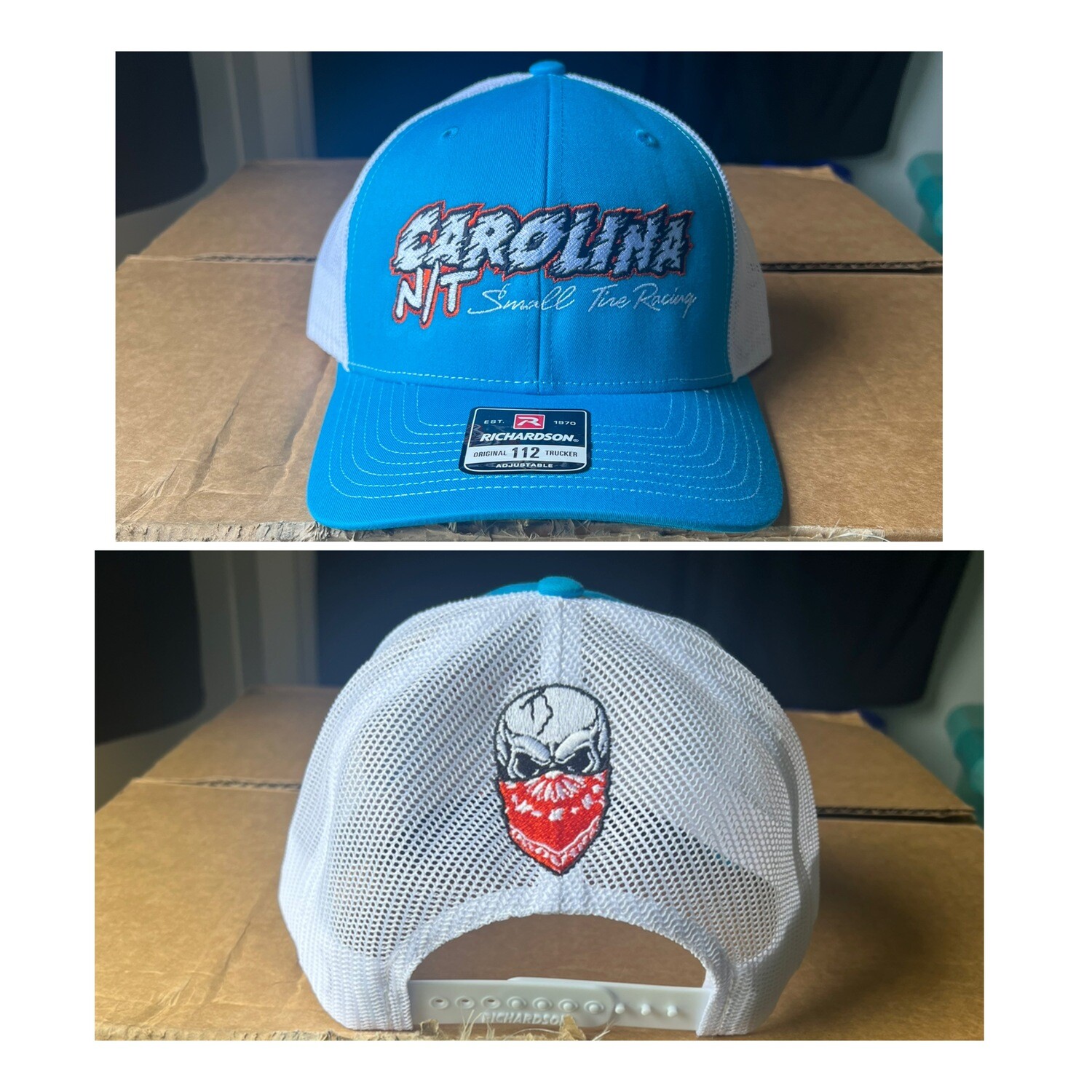 Carolina Blue /White with orange/white letters trucker hat
