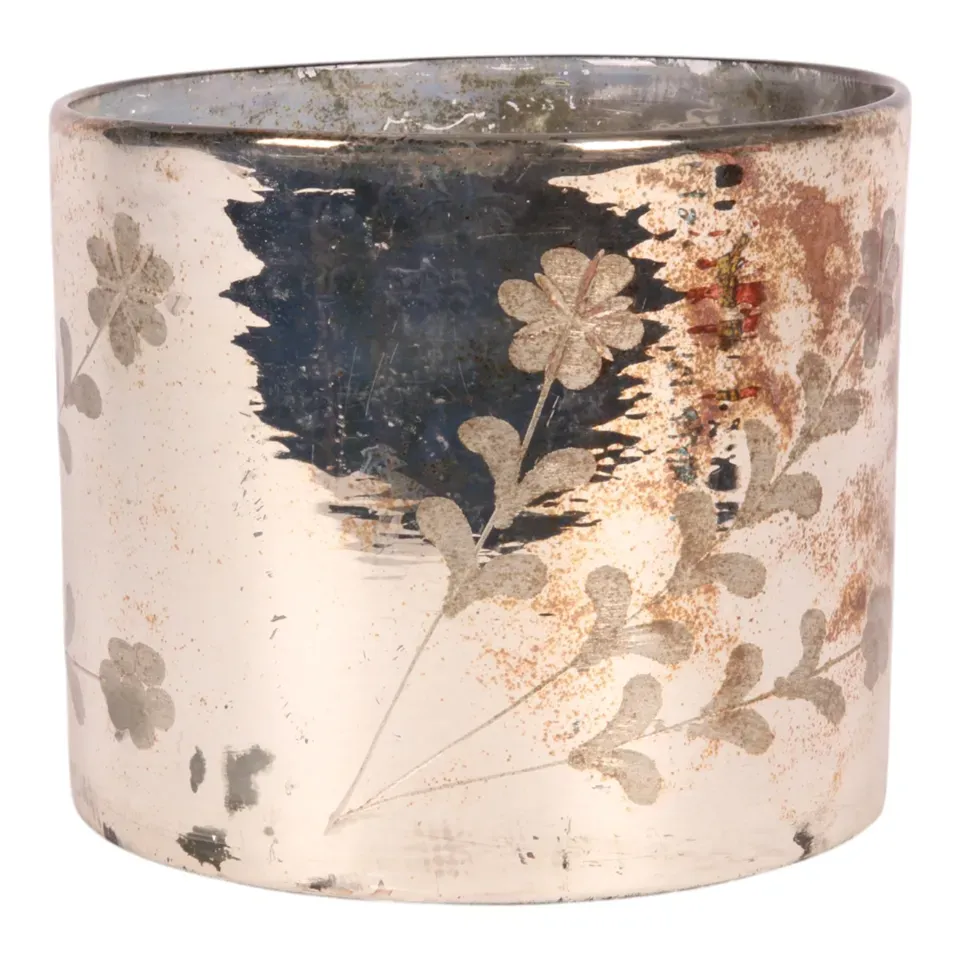goldener Teelichthalter aus Glas mit dekorativem Blumenmuster