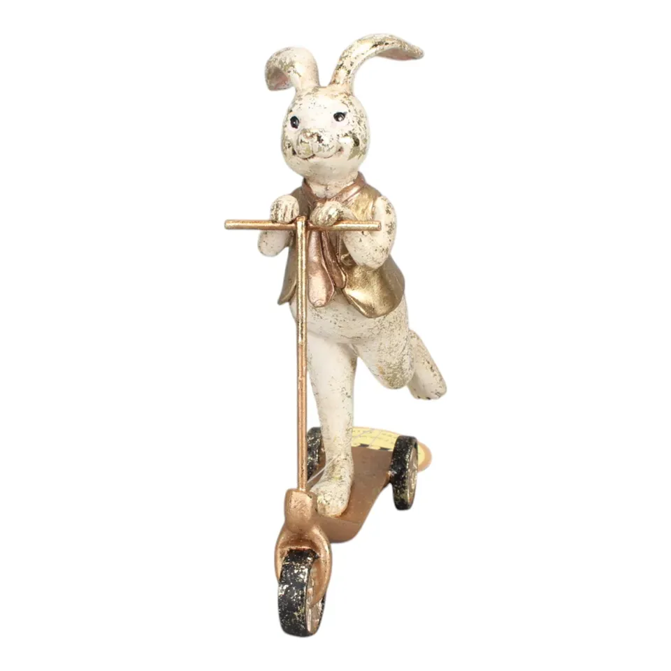 Hasenfigur, Kaninchen auf Tretroller, 17 cm, aus Kunstharz Hasenfigur aus Kunstharz, 17 cm, auf einem goldfarbenen Tretroller