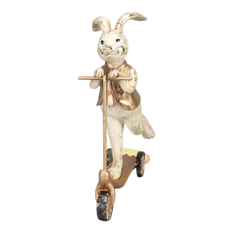 Hasenfigur, Kaninchen auf Tretroller, 17 cm, aus Kunstharz Hasenfigur aus Kunstharz, 17 cm, auf einem goldfarbenen Tretroller