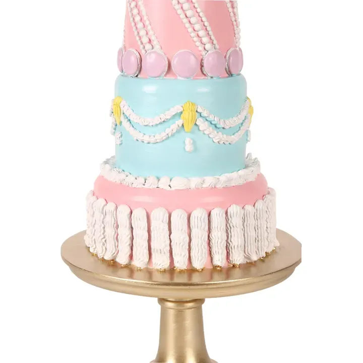 Dekofigur Torte 46 cm in Rosa und Türkis auf einem goldfarbenen Fuss