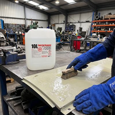 Professional using Multi Gel Remover 10L in industrial workshop with protective gloves and safety equipment