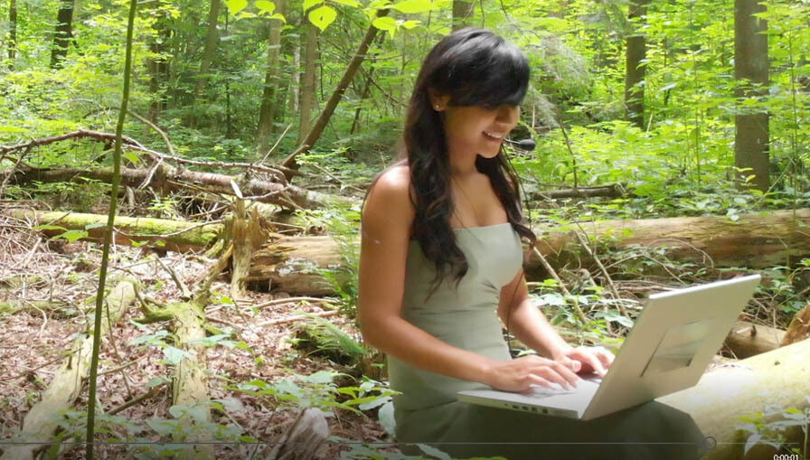 Young Woman Typing in the Forest -G 3 Young Woman Typing in the Forest -G 3