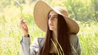 Woman Playing with Grass 1