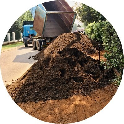 Truck offloading Soil such as Compost, Lawn Dressing, etc.