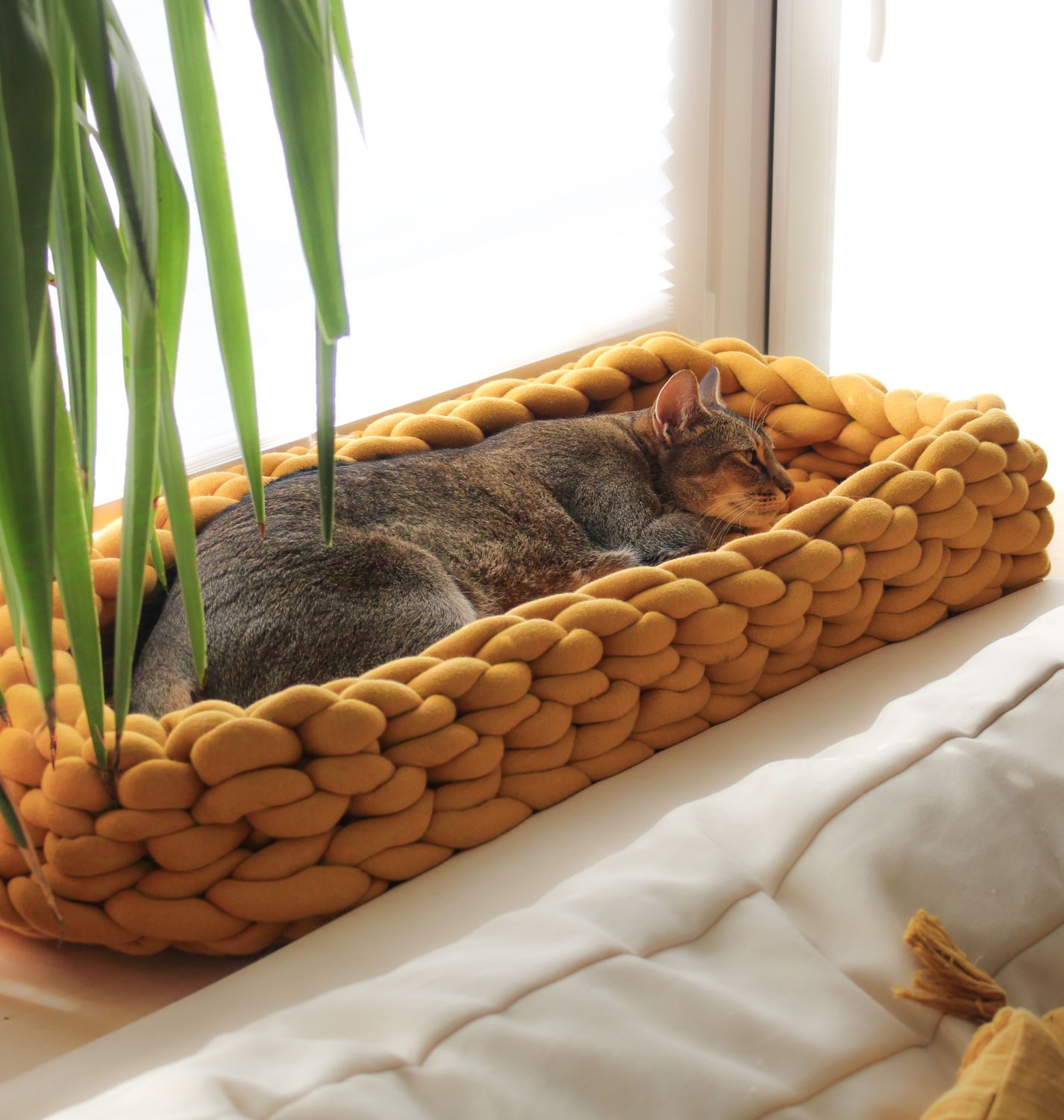 Eckiges Kuschelkörbchen aus Biobaumwolle – handgemacht Eckiges Kuschelkörbchen aus Biobaumwolle – handgemacht