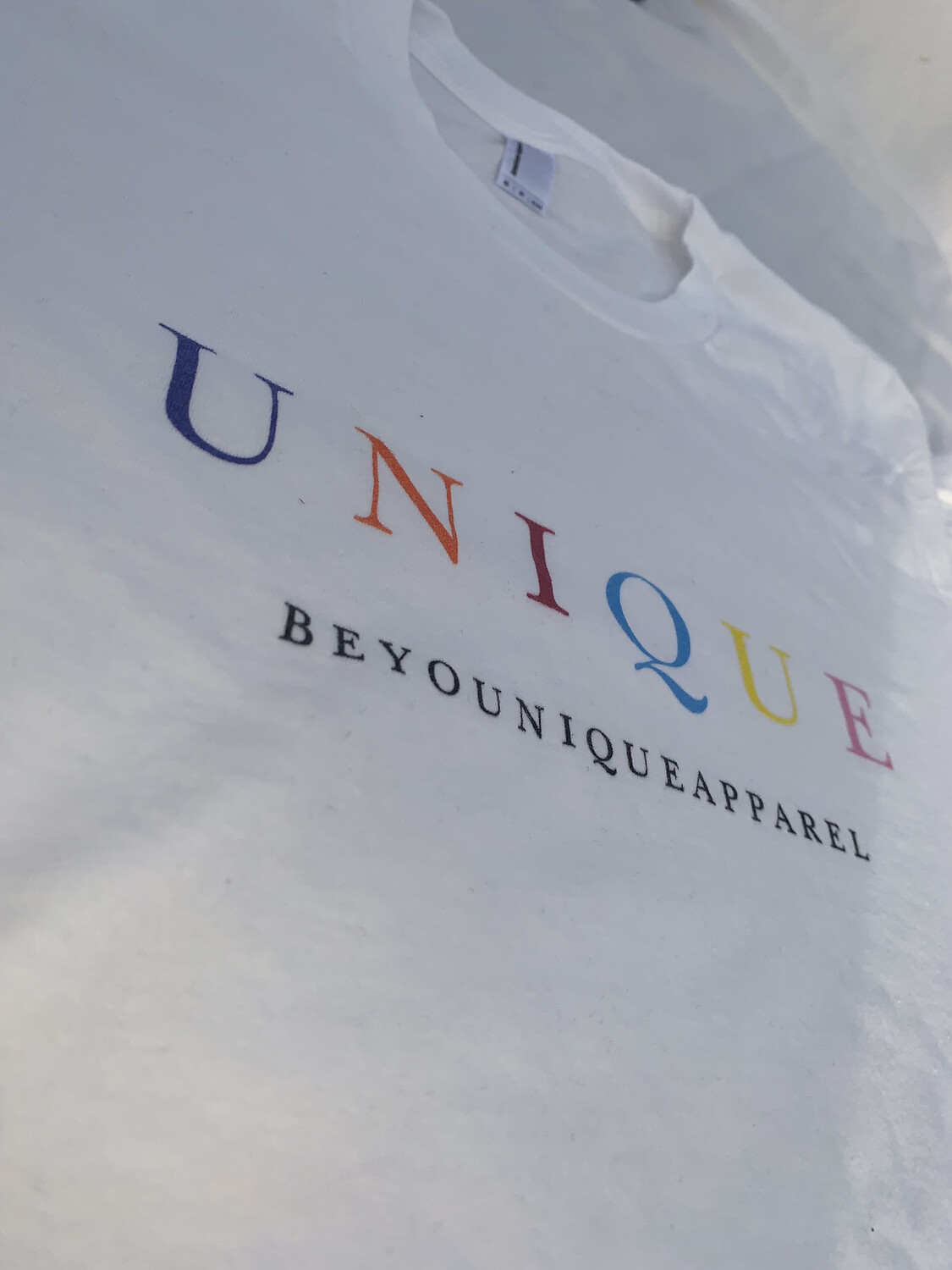 White Multi-colored “UNIQUE”  Logo Tee