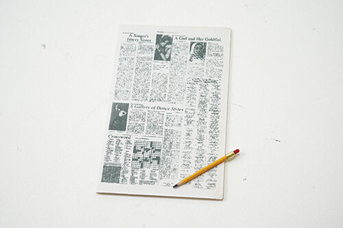 Newspaper with Crossword Puzzle with Pencil