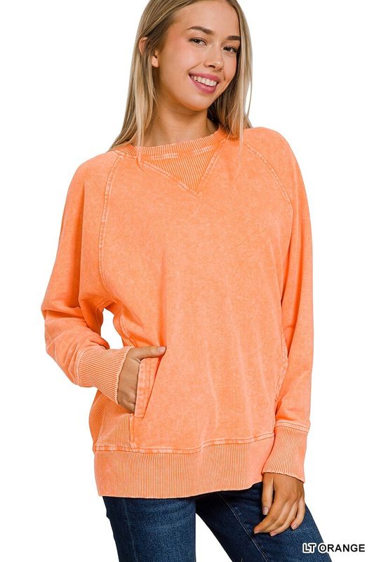 woman wearing orange pullover