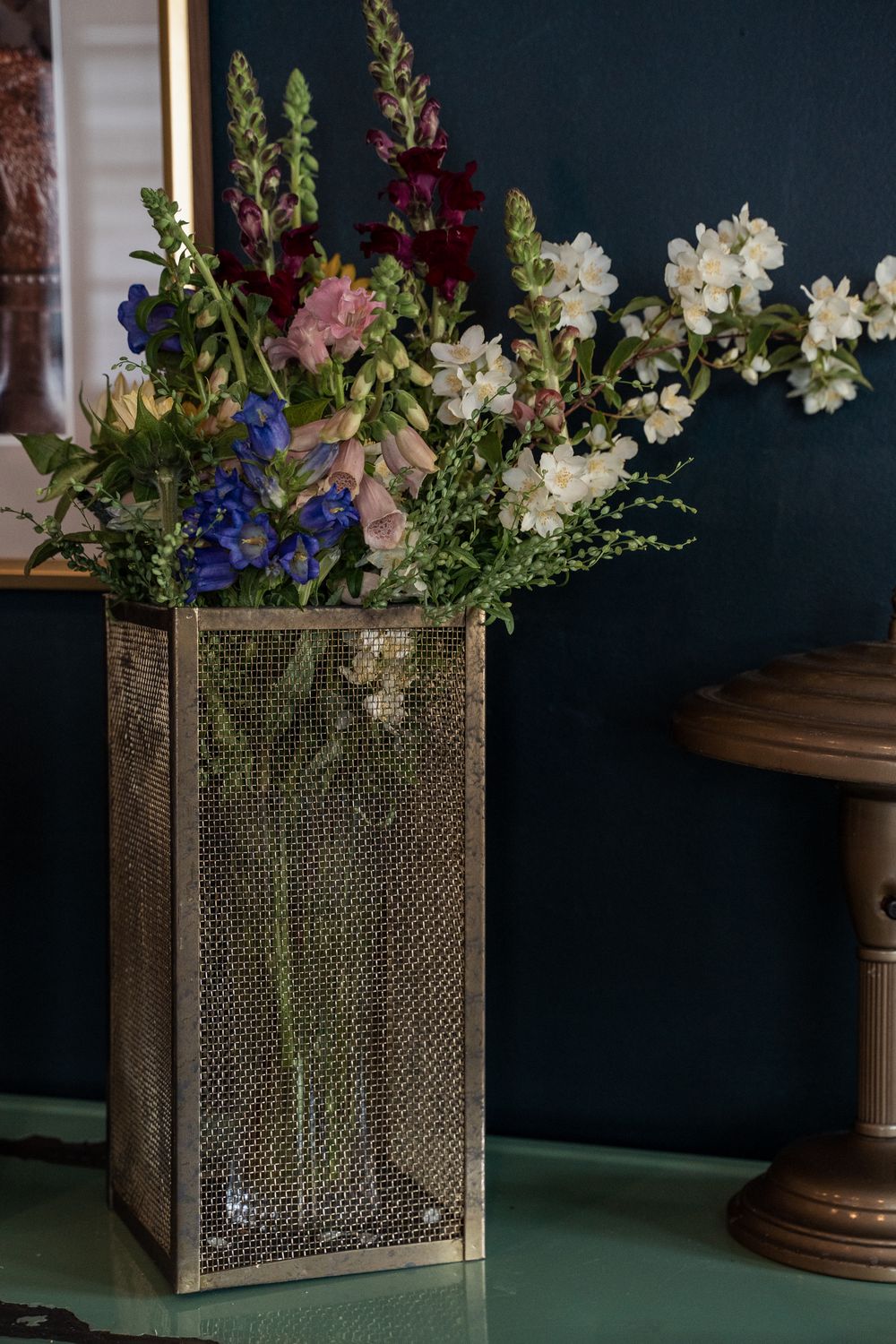 Hand-crafted gold mesh Hurricane with glass vase