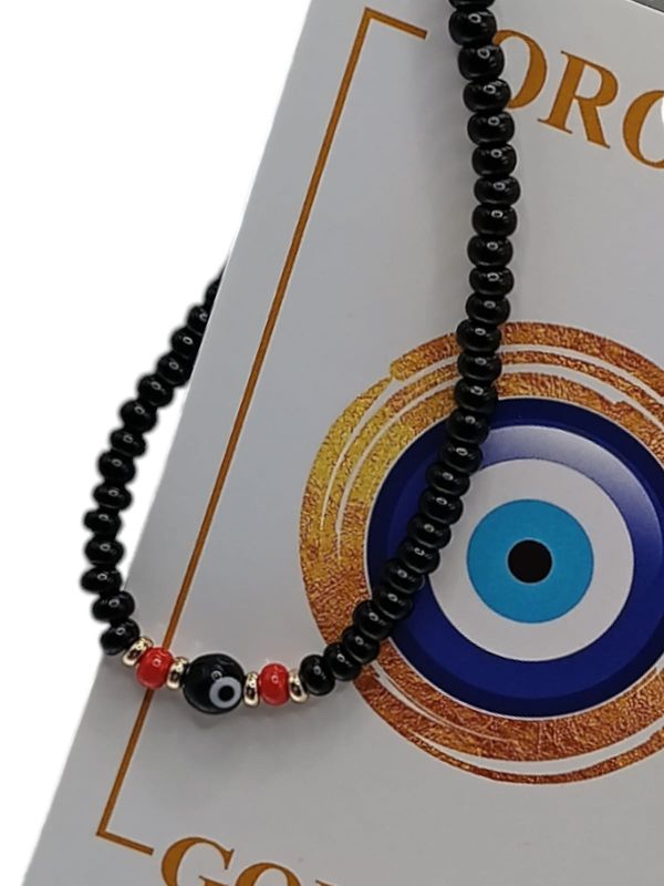 PULSERA HILO  OJITO NEGRA ORO 14K