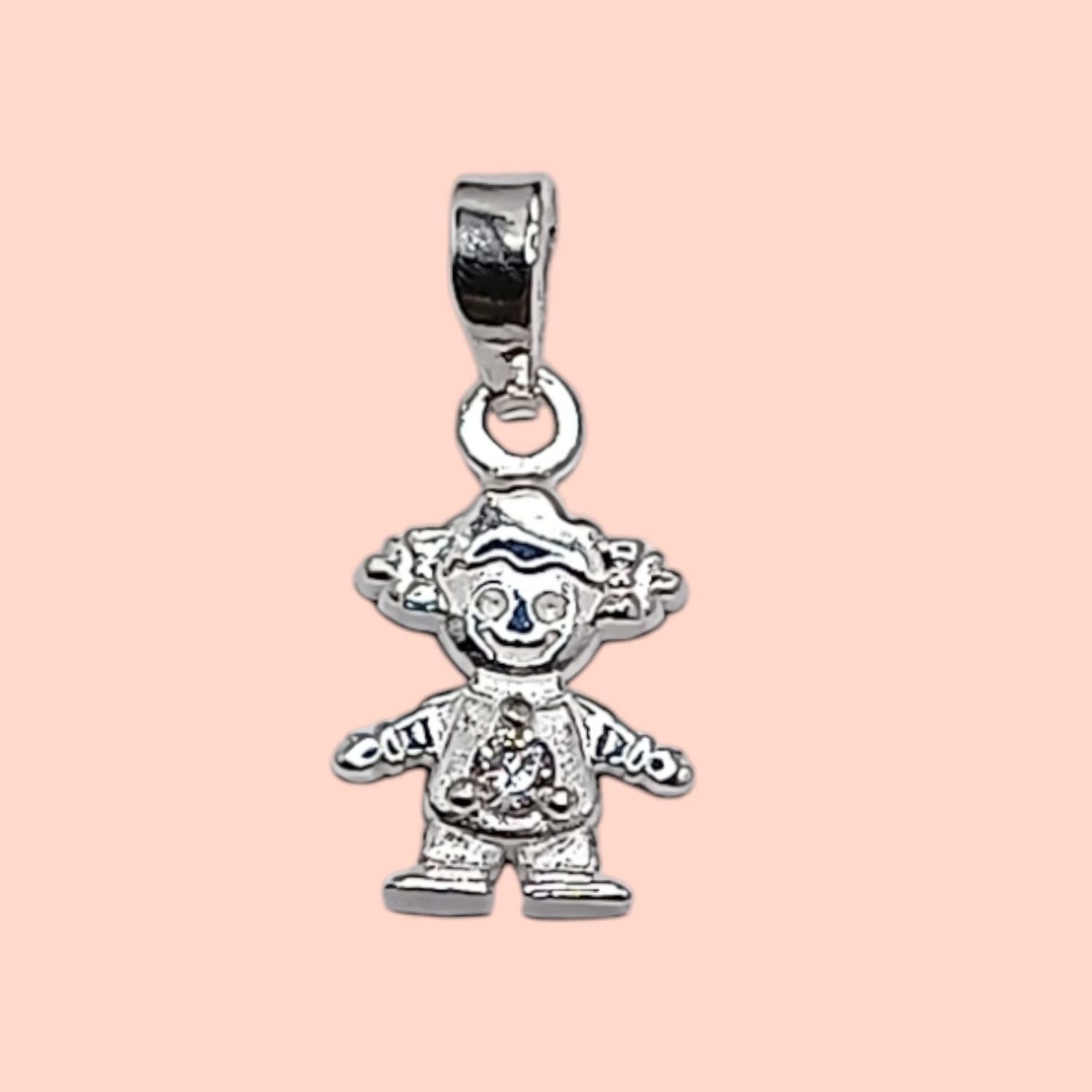 Dije niña Piedra Blanca. 1.8 cm. de largo. PLATA .925