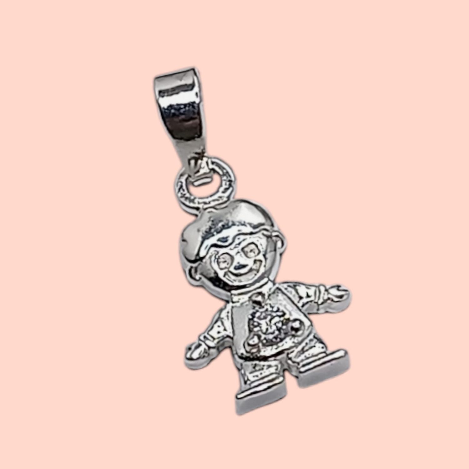 Dije niño Piedra Blanca. 1.8 cm. de largo. PLATA .925