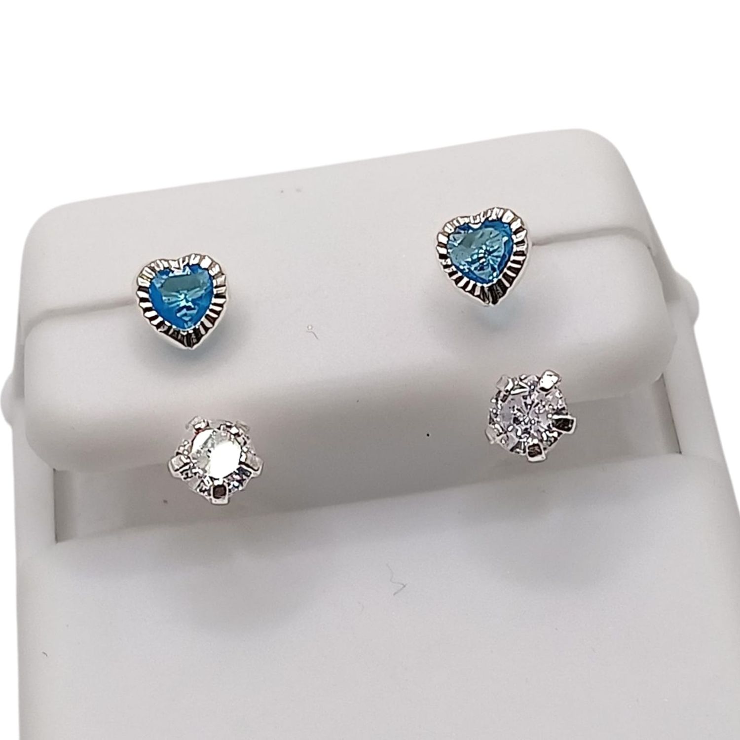 BROQUEL CURVO CORAZON BISEL CZ AZUL Y BCA, PLATA .925