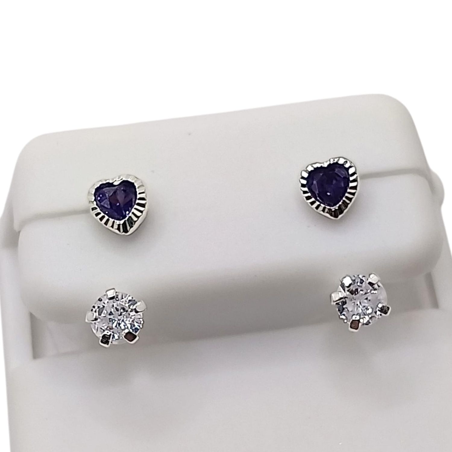 BROQUEL CURVO CORAZON BISEL CZ LILA Y BCA, PLATA .925