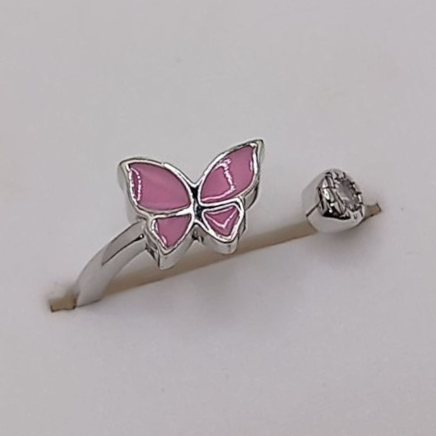 ANILLO NIÑA MARIPOSA ESMALTADA ROSA  AJUSTABLE PLATA 925 LEY.