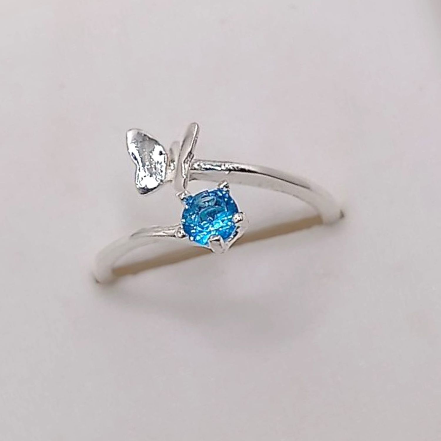 ANILLO NIÑAMARIPOSA Y CZ AZUL, AJUSTABLE, PLATA .925