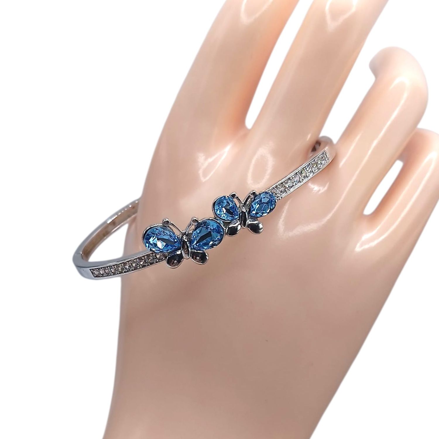ARO MARIPOSA CON CZ AZUL Y BCA, PLATA .925