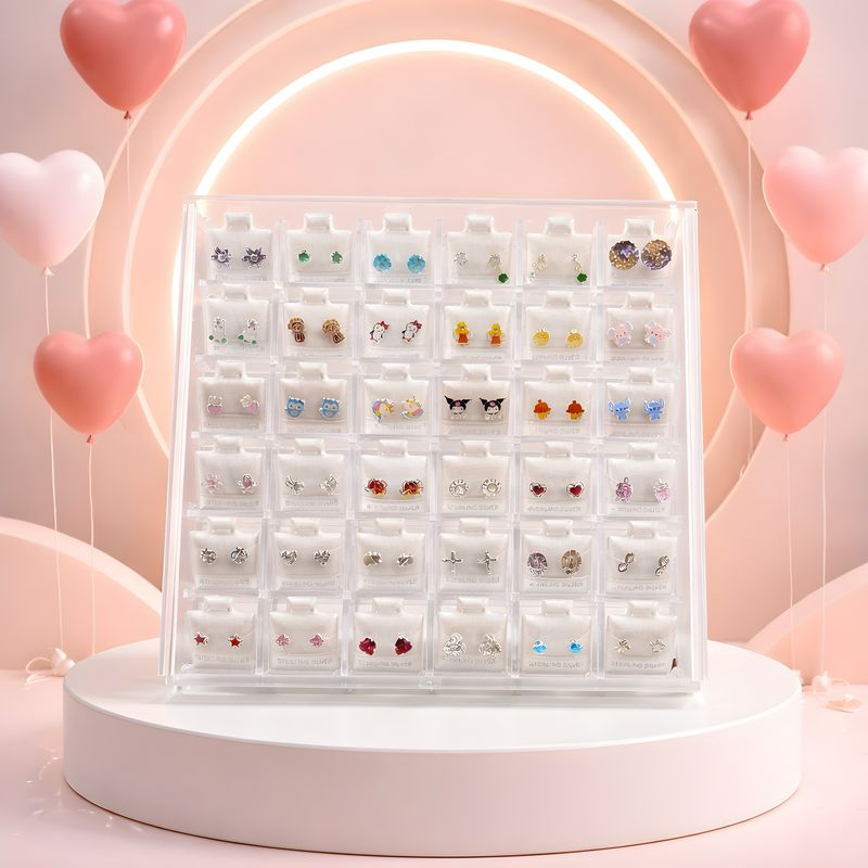 Caja acrílica con 36 pares de broquel en plata nueve 25 mexicano