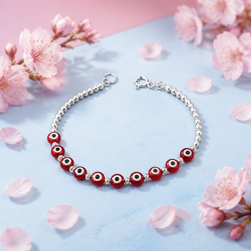 Pulsera  Ojitos Rojos mide 7" de largo, Plata 925 Mexicana.