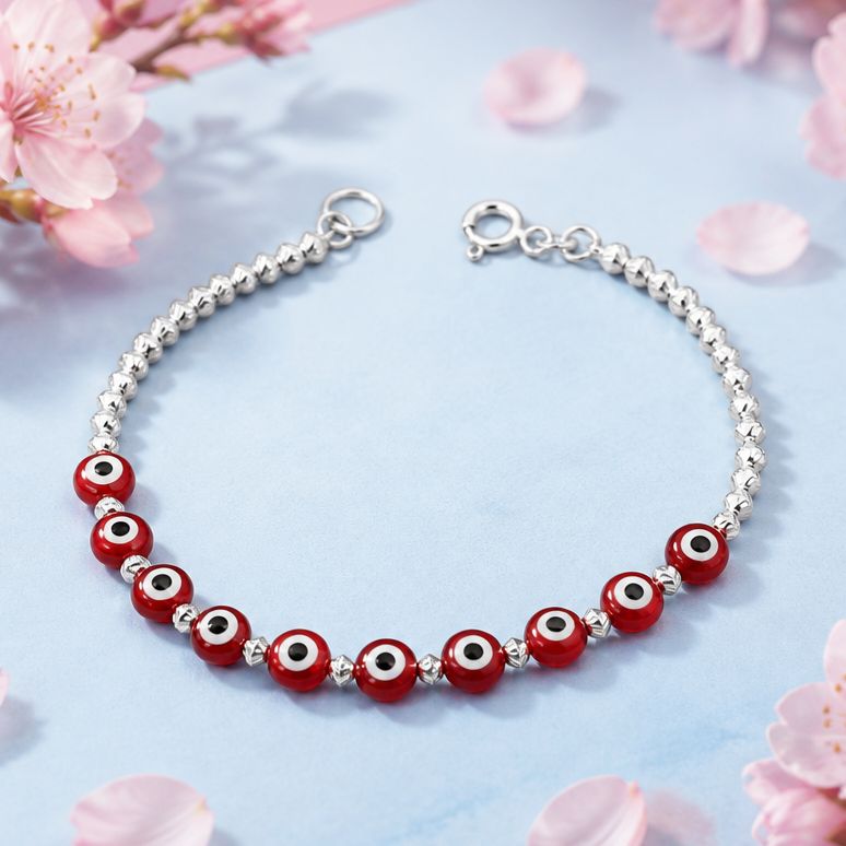 Pulsera  Ojitos Rojos mide 7" de largo, Plata 925 Mexicana.