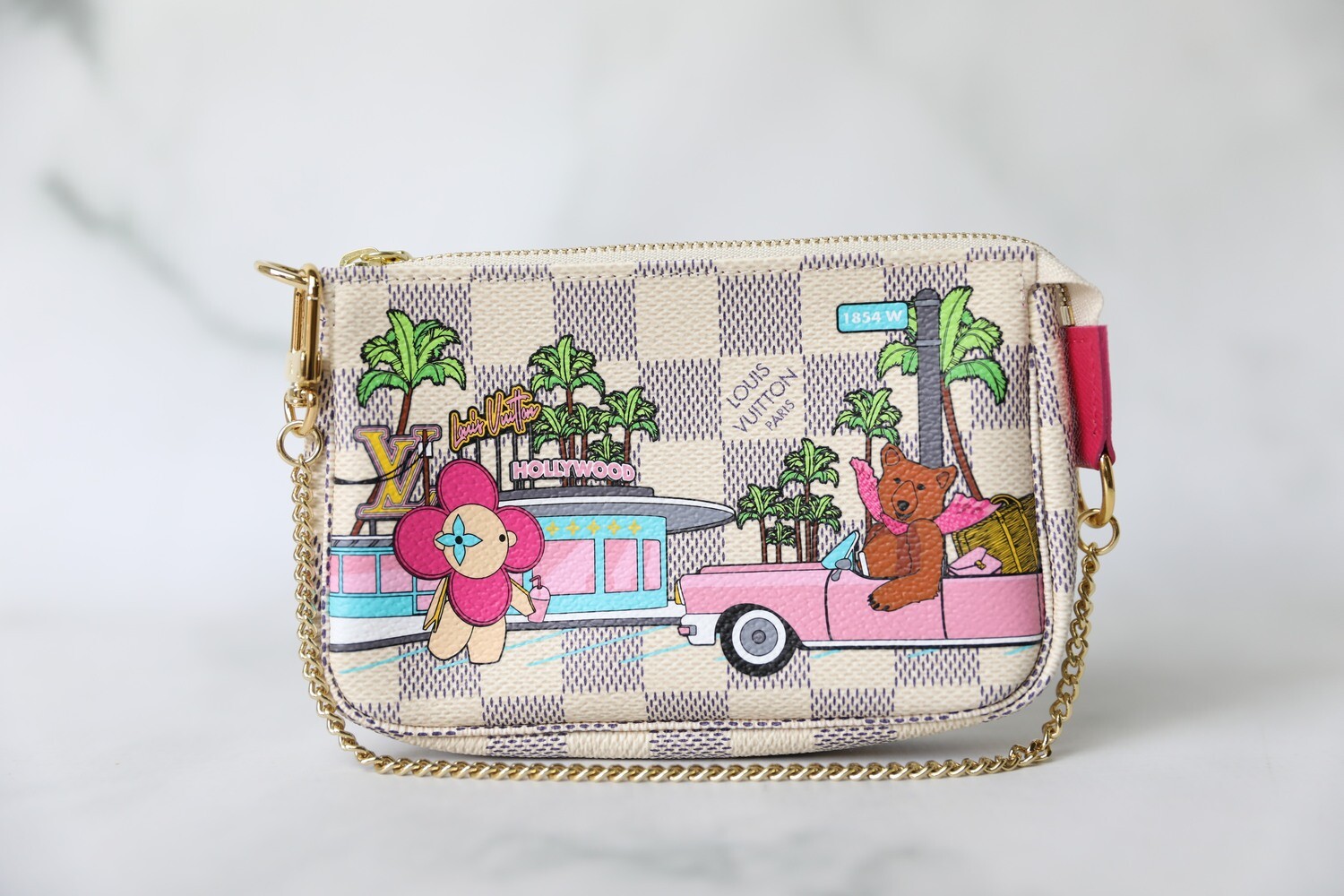 Louis Vuitton Holiday mini pochette accessories handbag, Japan –  VintageBooBoo Pre owned designer bags, shoes, clothes