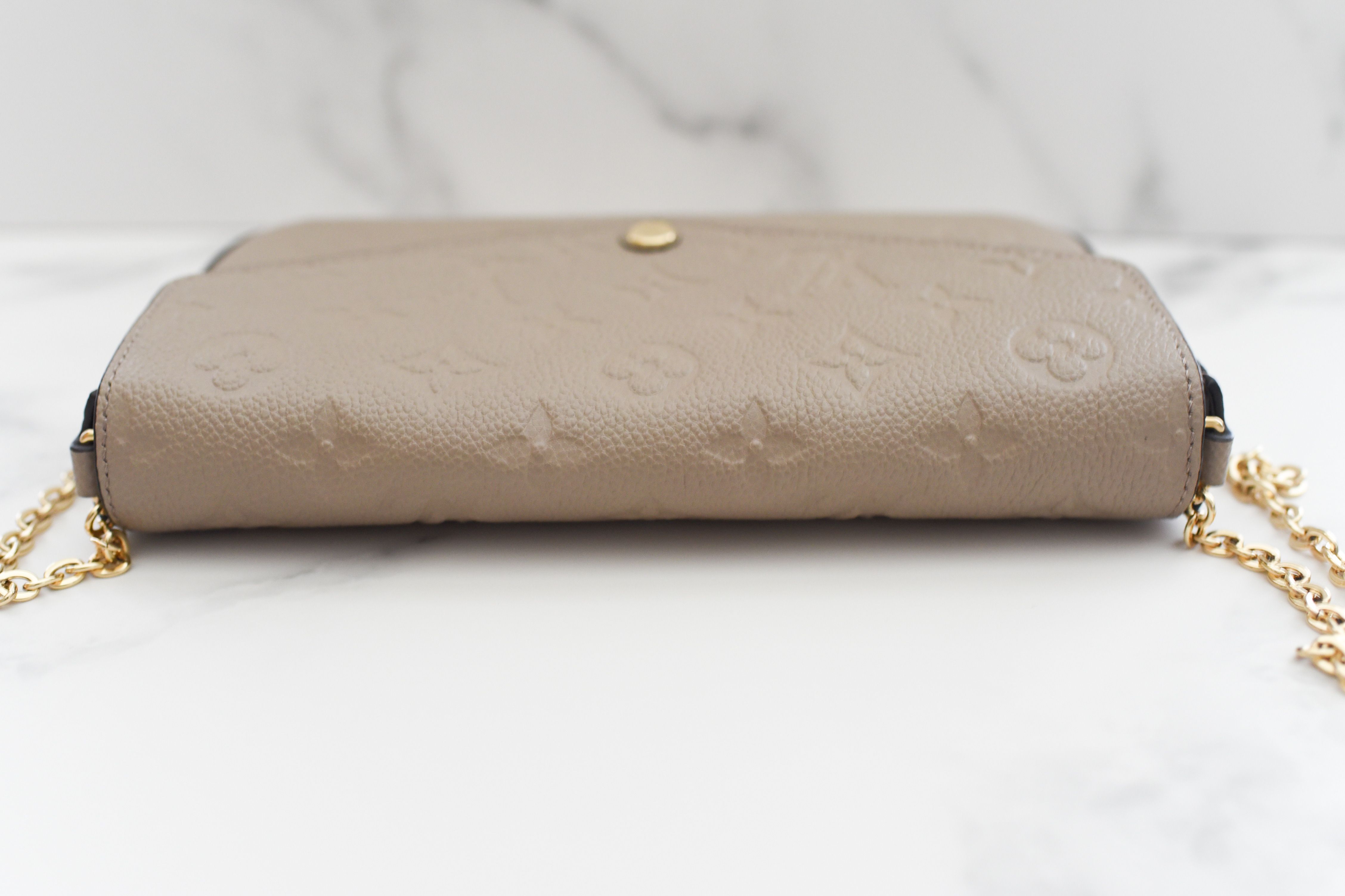 Haute Stuff by Kimberly - LV Felicie in Turtle Dove Detailed Features: ‭8.3  x 4.7 x 1.2 inches ‬ ‭(length x Height x Width)‬ * ‭Tourterelle Beige‬ *  ‭Monogram Empreinte embossed supple‬