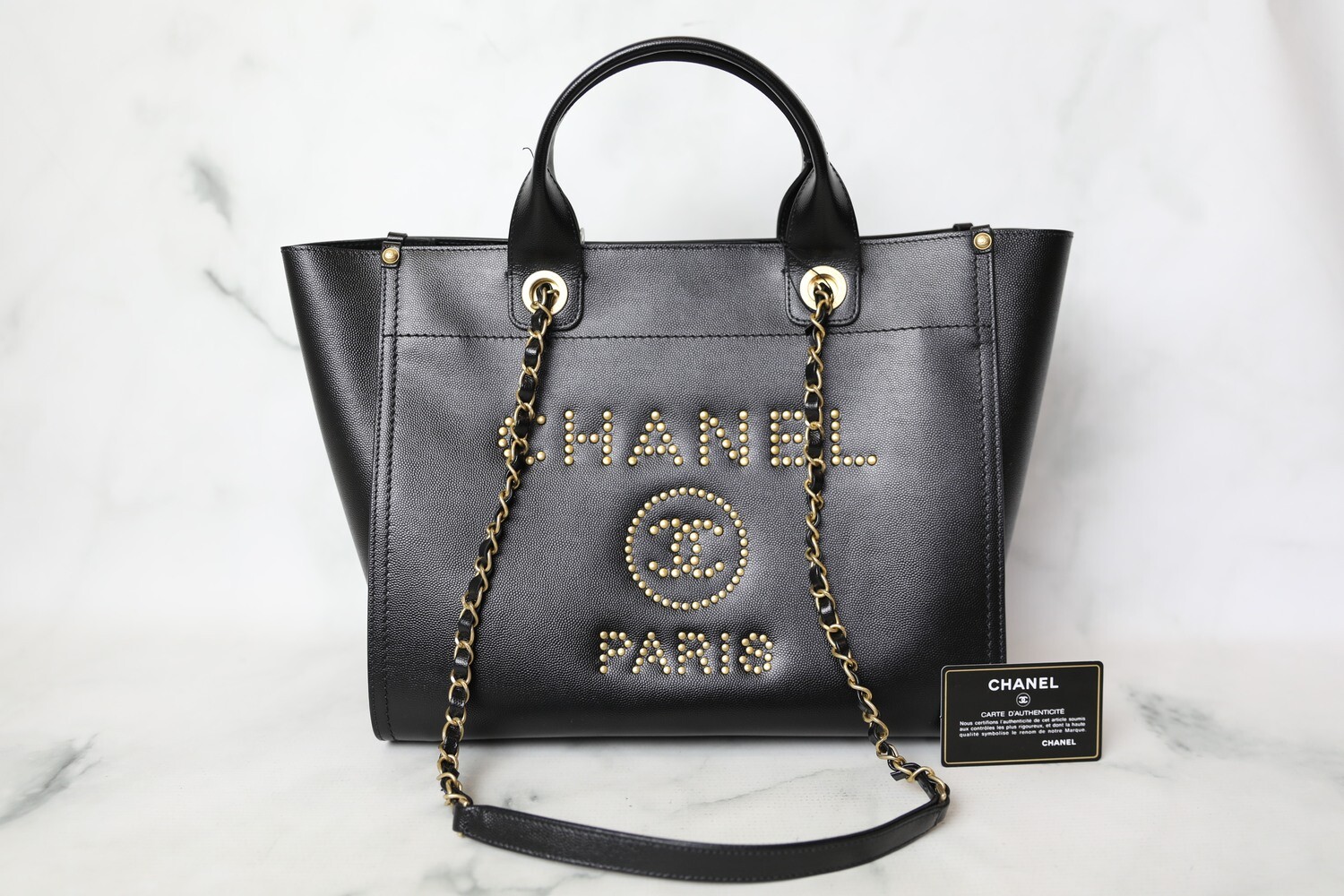 Chanel studded caviar leather deauville with silver hardware