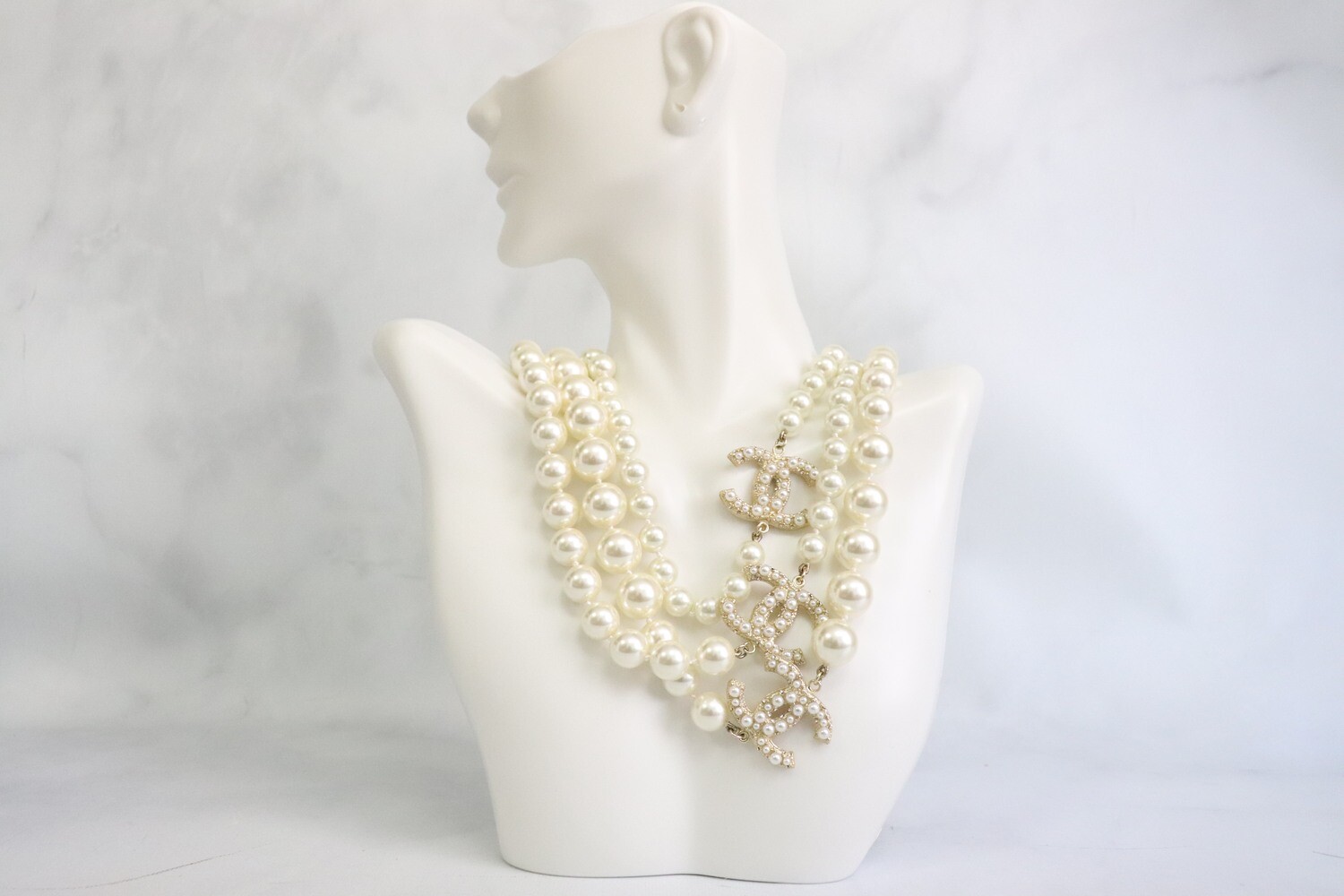 Sold at Auction: A VERY GOOD CHANEL GILT AND PEARL NECKLACE with twelve  sections with six pearls. 36ins long.