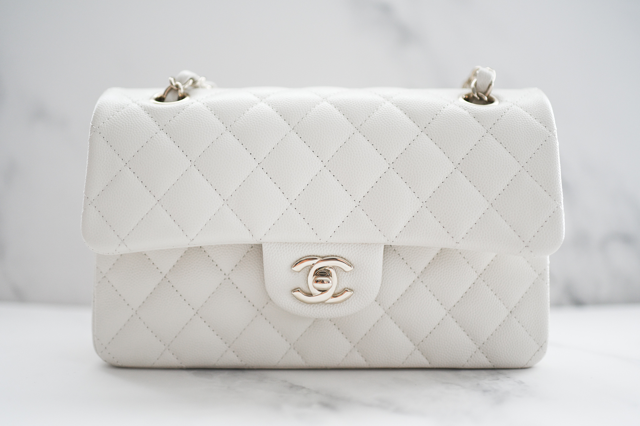 white and silver chanel bag