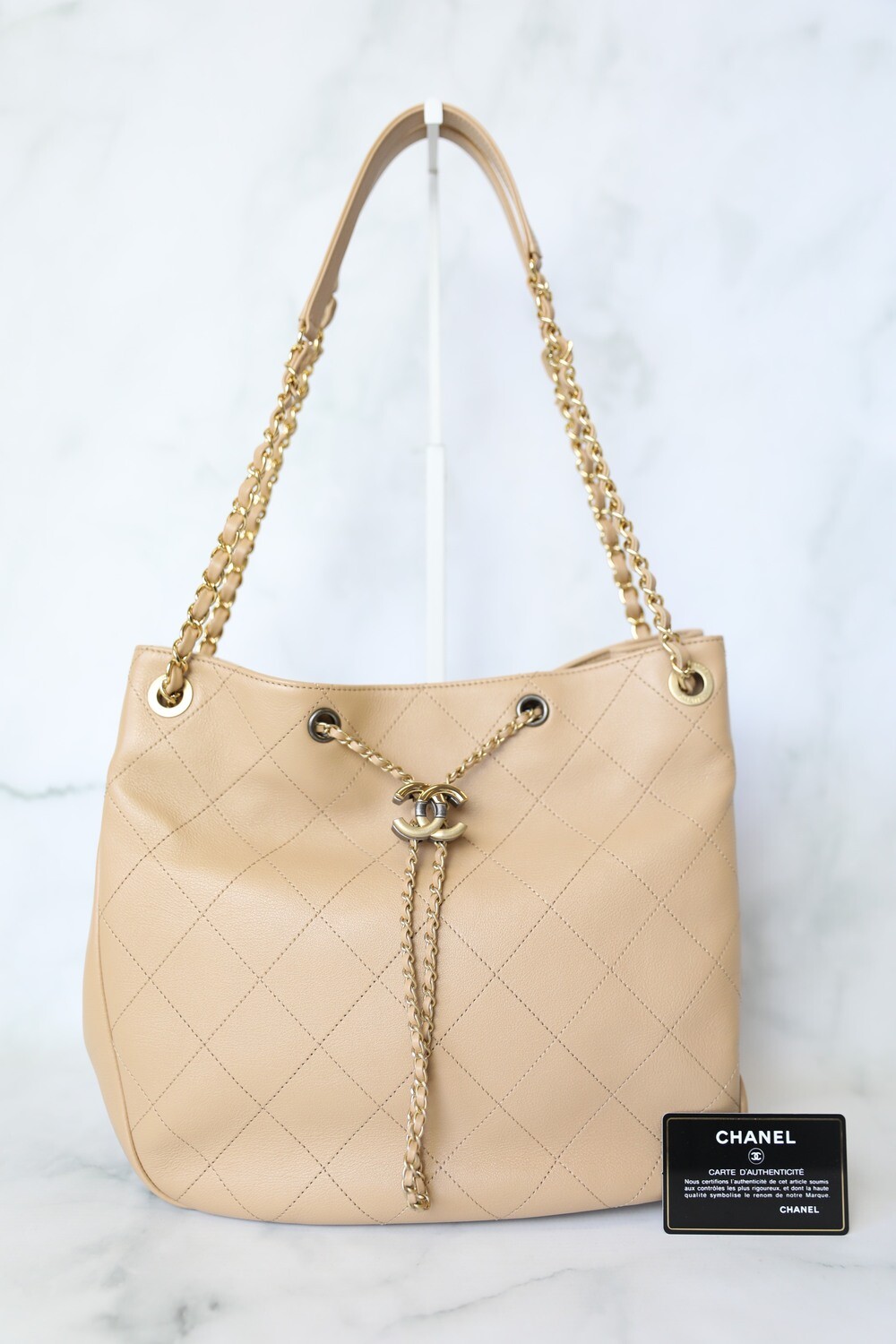 Chanel Quilted Drawstring Tote Beige Calfskin with Gold and Ruthenium Hardware Preowned in Dustbag WA001