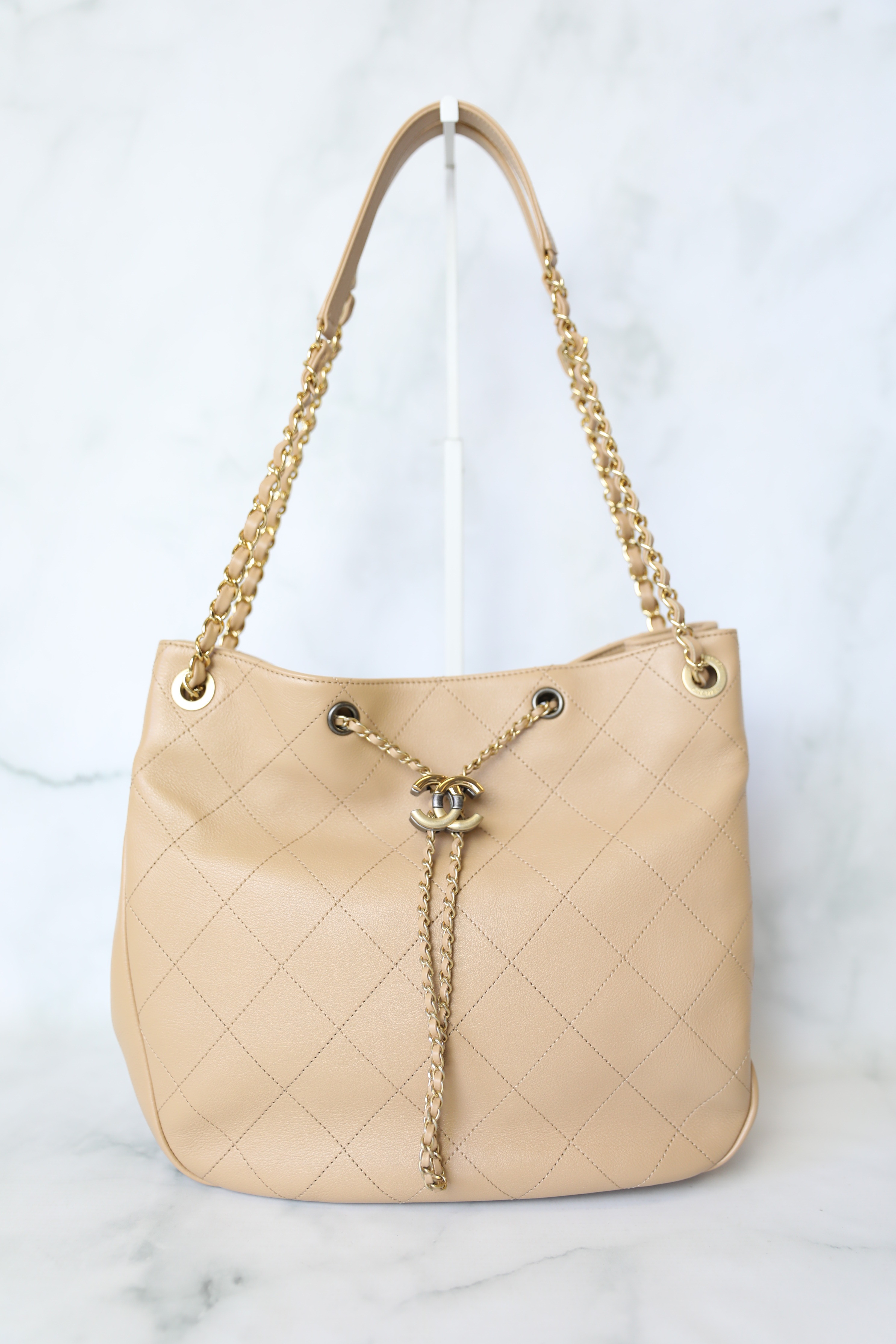 Chanel Quilted Drawstring Tote, Beige Calfskin with Gold and Ruthenium  Hardware, Preowned in Dustbag WA001