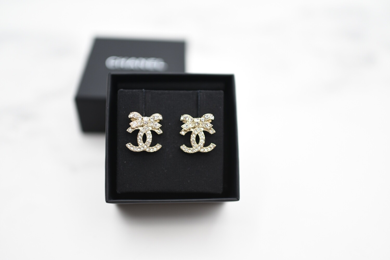 Chanel Earrings CC Ribbon Studs, Gold Hardware with Crystals, New