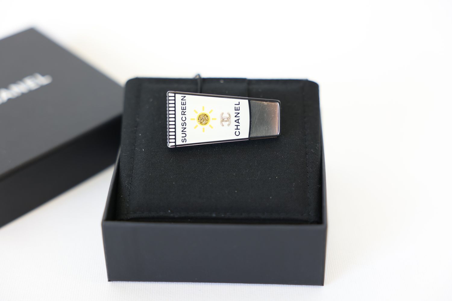 Chanel Brooch, Enameled Sunscreen Bottle, Gold Metal And White, New In Box WA001