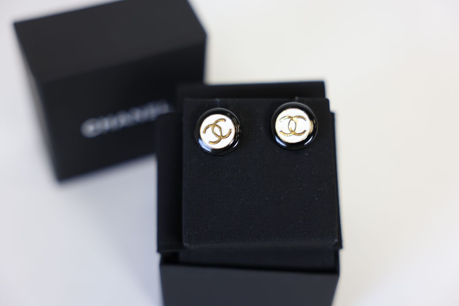 Chanel 24P CC Logo Stud Earrings, Black And White Enameled With Gold Hardware, Preowned in Box WA001