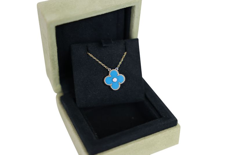 Van Cleef & Arpels Vintage Alhambra 2019 Holiday Pendant Necklace. 18k Yellow Gold with Celestial Blue Porcelain  and a Diamond, Preowned in Box WA001