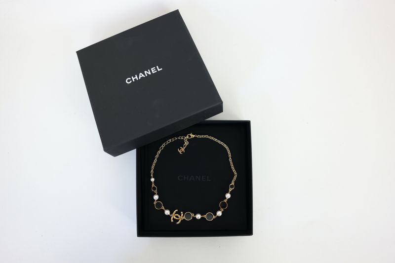 Chanel CC 24C Station Necklace, Gold Finish with Resin Pearl and Black Enamel, Preowned in Box WA001 Chanel CC 24C Station Necklace, Gold Finish with Resin Pearl and Black Enamel, Preowned in Box WA001